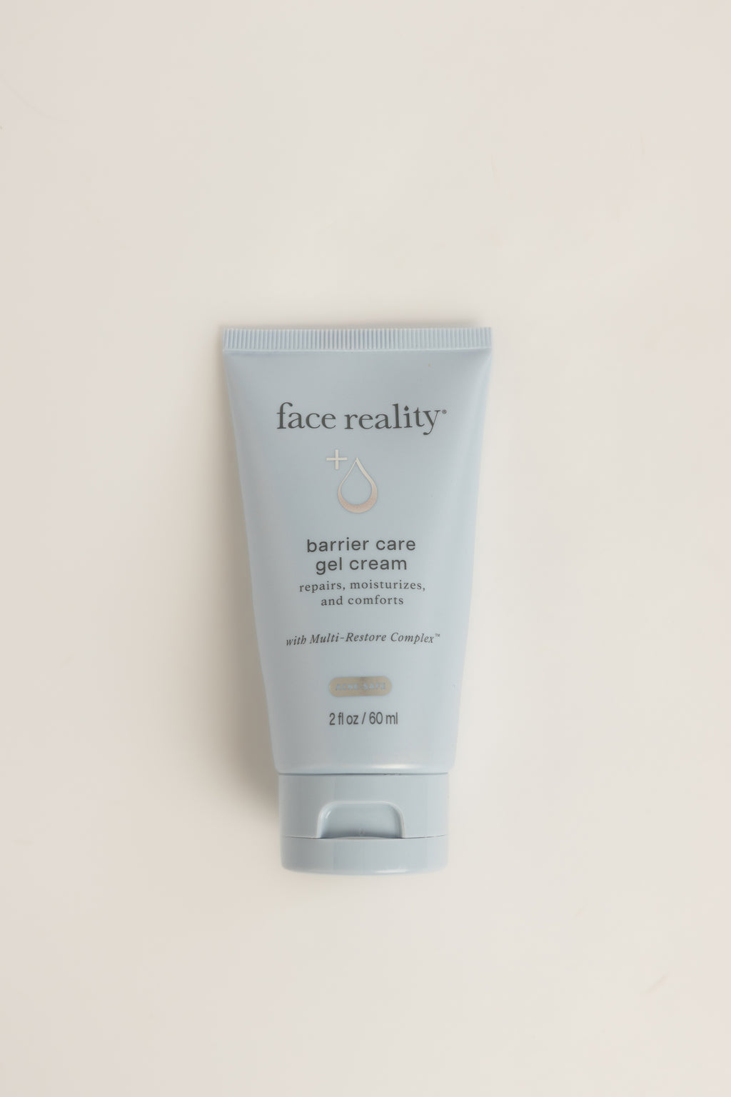 Light blue Face Reality Barrier Care Gel Cream tube with dark text, standing upright on a light background, net weight 2 fl oz (60 ml)