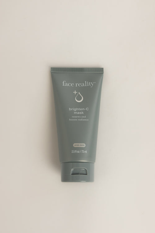 Blue Face Reality Brighten-C Mask tube with white text, standing upright on a light gray background, net weight 2.5 fl oz (73 ml)